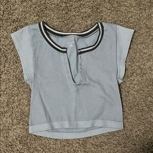 Out from under Blue Top